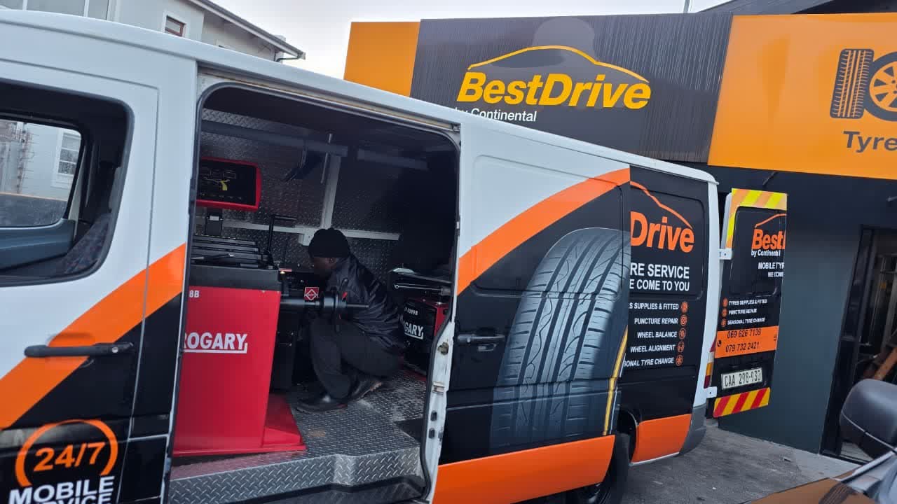 Best Drive technician working on a wheel inside the mobile tyre fitment van