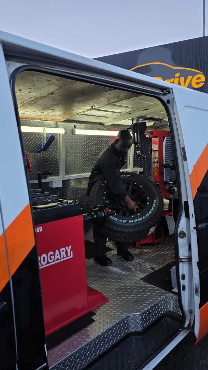 A wheel mounted on the balancing machine inside the Best Drive mobile tyre van